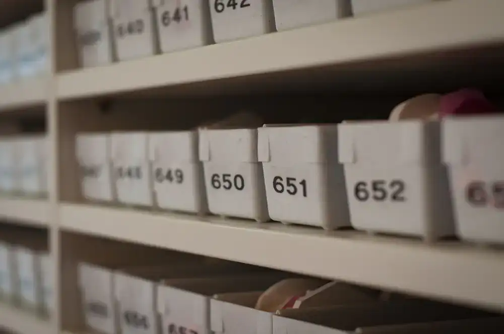 Close-up of retail shelves meticulously organized by player count with colorful game boxes